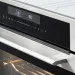 Detalhe do painel de comandos e do puxador do Forno Oven Grill Crissair com o interior aceso